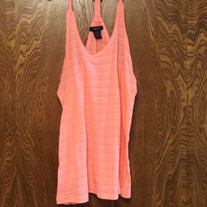 Salmon colored tank top with braided straps.